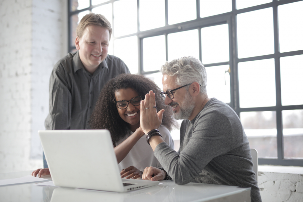 happy emplyees at work mental wellbeing