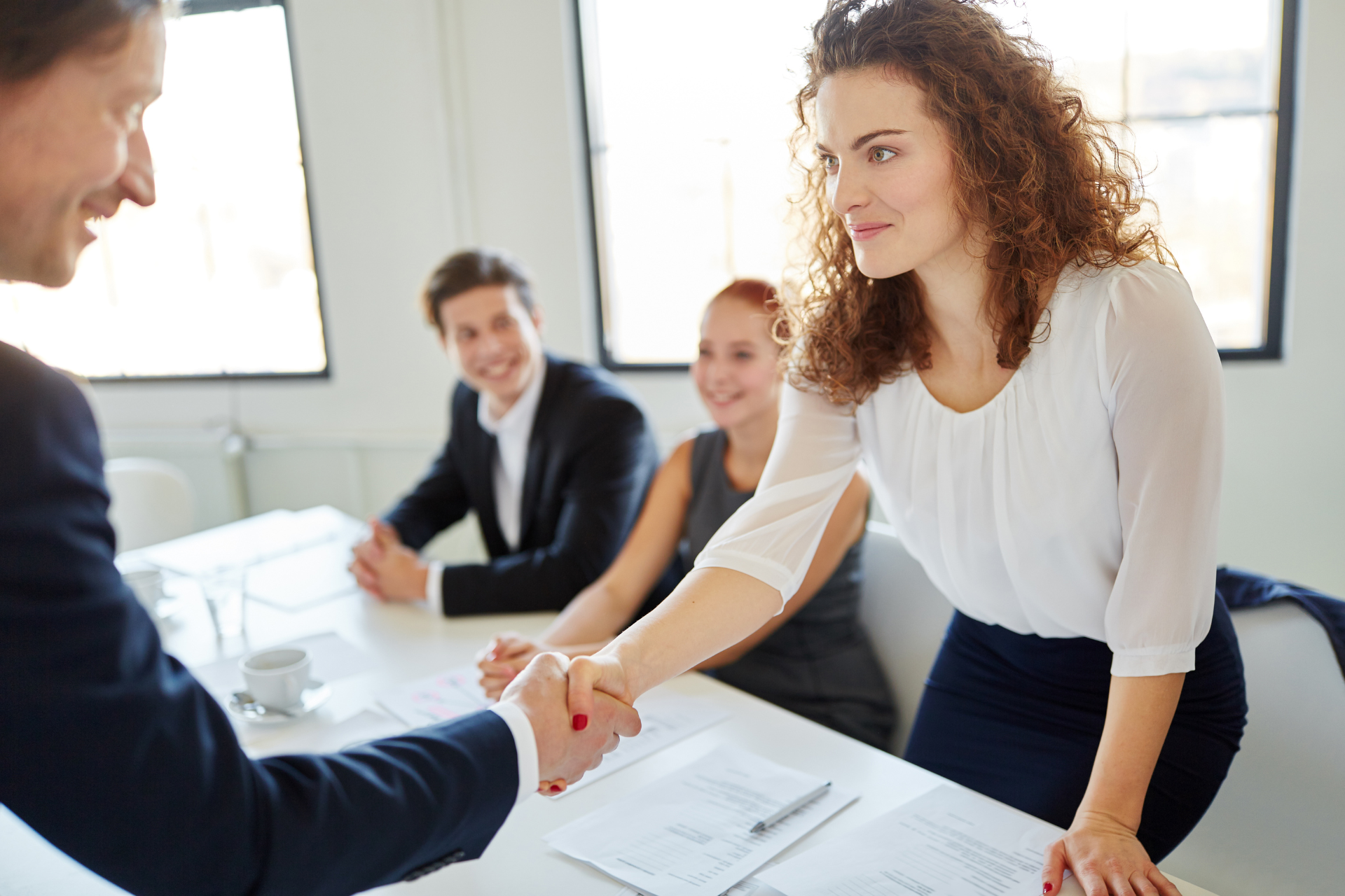 woman promotion hand shake